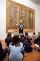 Students from Seville Primary School listen to a talk on McCubbin's painting The pioneer.
&copy; National Gallery of Victoria, Melbourne
