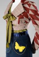 DORIS DE PONT, Auckland (fashion house); Doris DE PONT (designer)
Outfit: Battle jacket, Idol shirt, Cortina skirt 2006 {Sampler collection, winter 2007} (detail)
cotton, lycra (velvet), polyester, acetate, transparent synthetic polymer resin, nylon
(a) 41.0 cm (centre back)
59.0 cm (sleeve length) (jacket)
(b) 68.0 cm (centre back)
23.5 cm (sleeve length) (shirt)
(c) 68.0 m (centre back)
35.0 cm (waist, flat) (skirt)
(d) 7.0 x 116.0 cm (belt)
(e-f) 35.5 x 12.0 cm (mittens) (each)
(g) 90.0 x 19.0 cm (tights)

National Gallery of Victoria, Melbourne
Purchased NGV Foundation, 2008
2008.249.a-g

&copy; Doris de Pont
