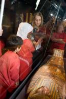 Senior Educator Michele Stockley shows students one of the wonders from the NGV's Egyptian collection.
&copy; National Gallery of Victoria, Melbourne