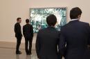 Corporate Members viewing Jeff Wall Photographs
&copy; Jeff Wall
