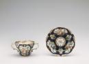 Two handled cup and saucer