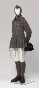 Nordic salesman in swing dress wearing showgirl choker