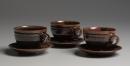 Three breakfast cups and saucers