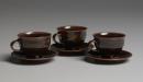 Three coffee cups and saucers