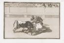 A picador is unhorsed and falls under the bull