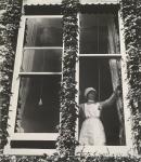 Parlourmaid at a window in Kensington