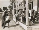 Haircutting in front of plantation store after being paid off on Saturday, Mileston Plantation, Mississippi Delta