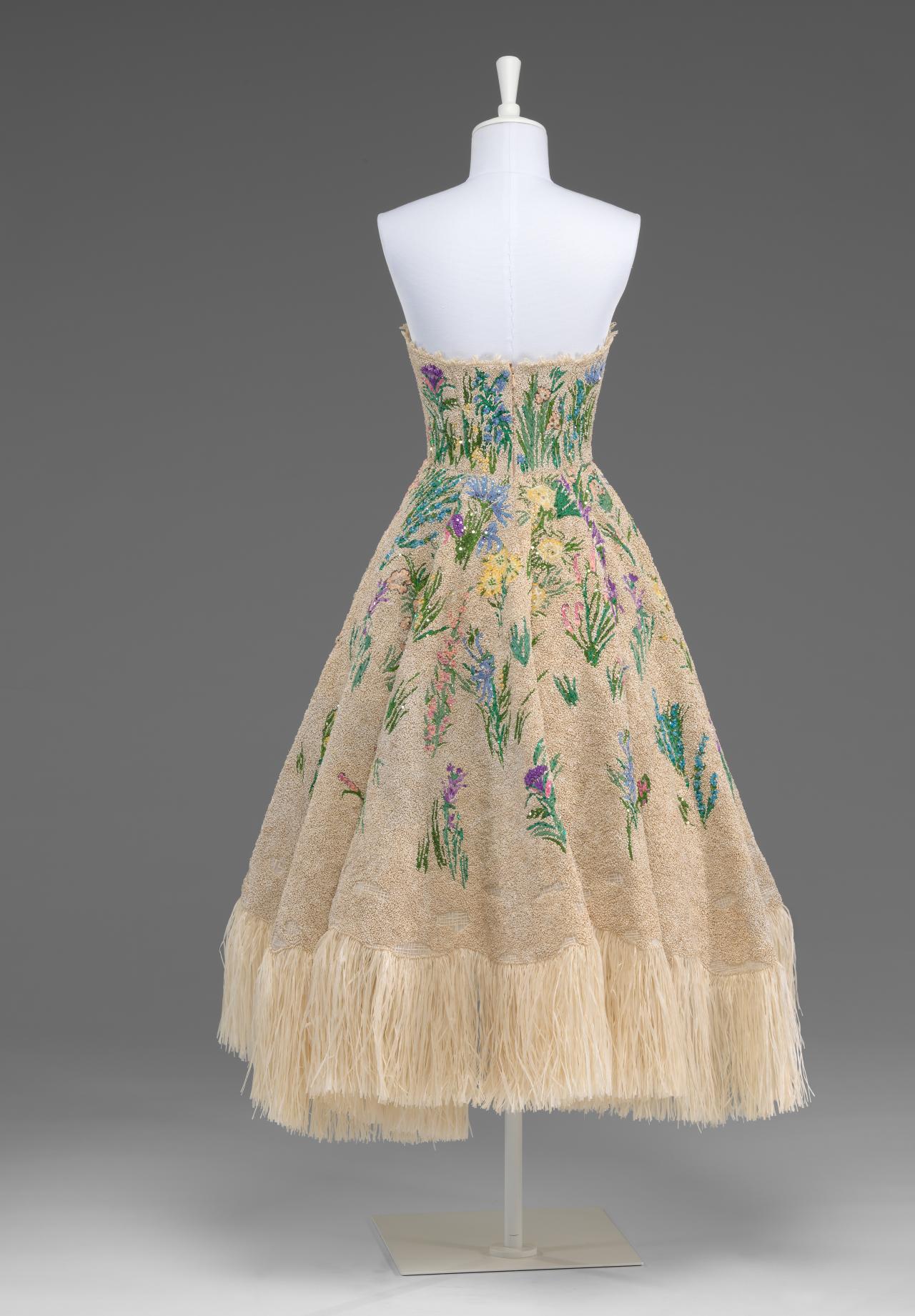 CHRISTIAN DIOR, Paris (couture house)<br />
 Maria Grazia CHIURI (designer)<br/>
<em>Spirit of Herbarium (Essence d&rsquo;Herbier)</em> 2017 {spring-summer} <!-- (view ) --><br />

silk (organza), nylon (tulle), embroidery, raffia. metal (spangles)<br />
(a) 105.0cm (centre back) 30.0 cm (waist, flat) (dress) (b) 68.5 cm (centre back) 30.0 cm (waist, flat) (underskirt)<br />
National Gallery of Victoria, Melbourne<br />
David Richards Bequest and NGV Supporters of Fashion and Textiles, 2018<br />
2017.457.a-b<br />
&copy; Christian Dior Couture
<!--127527-->