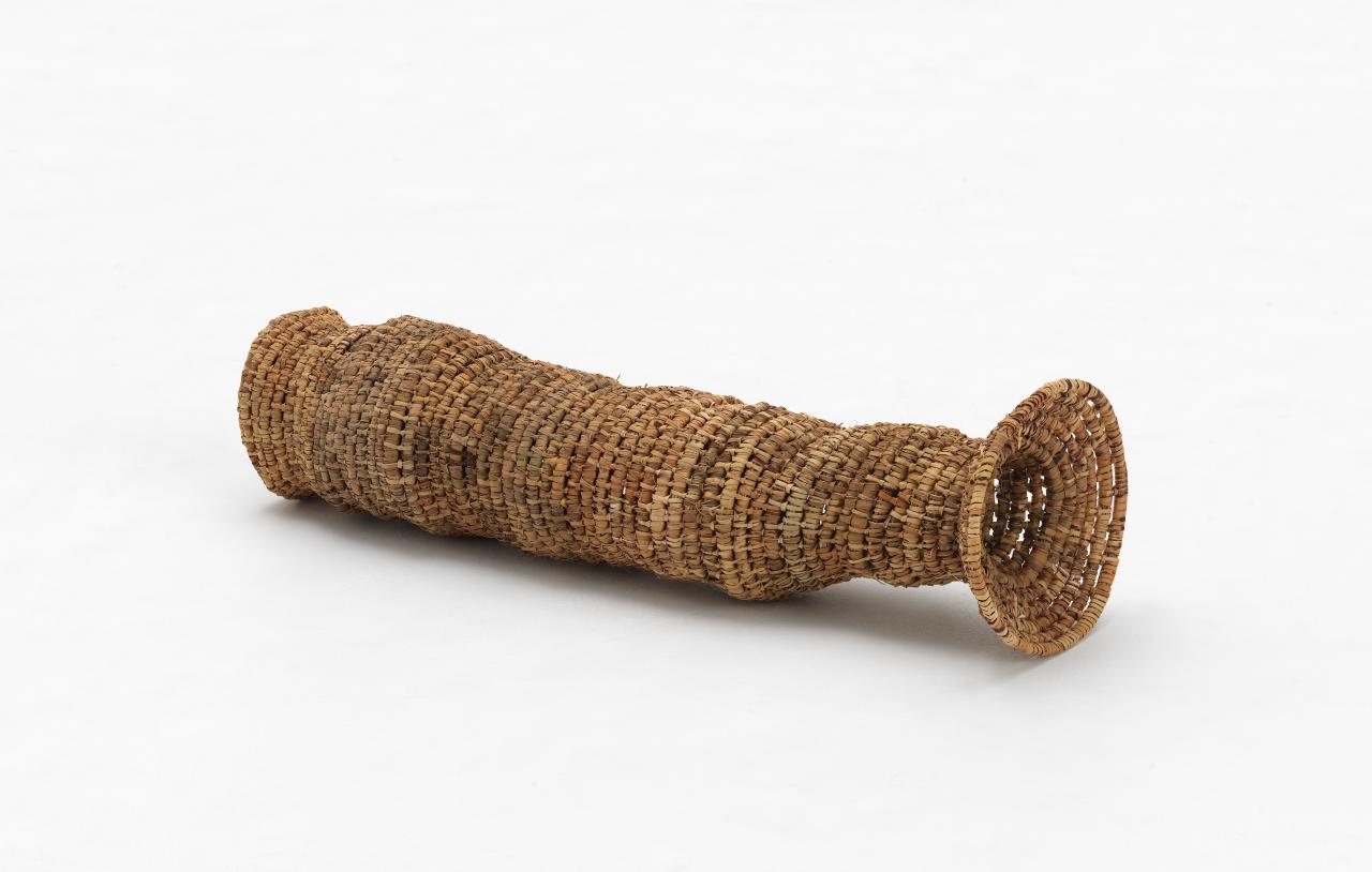 Dot Peters<br/>
<em>Eel trap</em> 2004 <!-- (full view) --><br />

sword grass and flax<br />
20.4 x 72.8 x 23.3 cm<br />
National Gallery of Victoria, Melbourne<br />
Purchased with funds donated by Supporters and Patrons of Indigenous Art, 2004<br />
2004.76<br />
&copy; Dot Peters
<!--75718-->