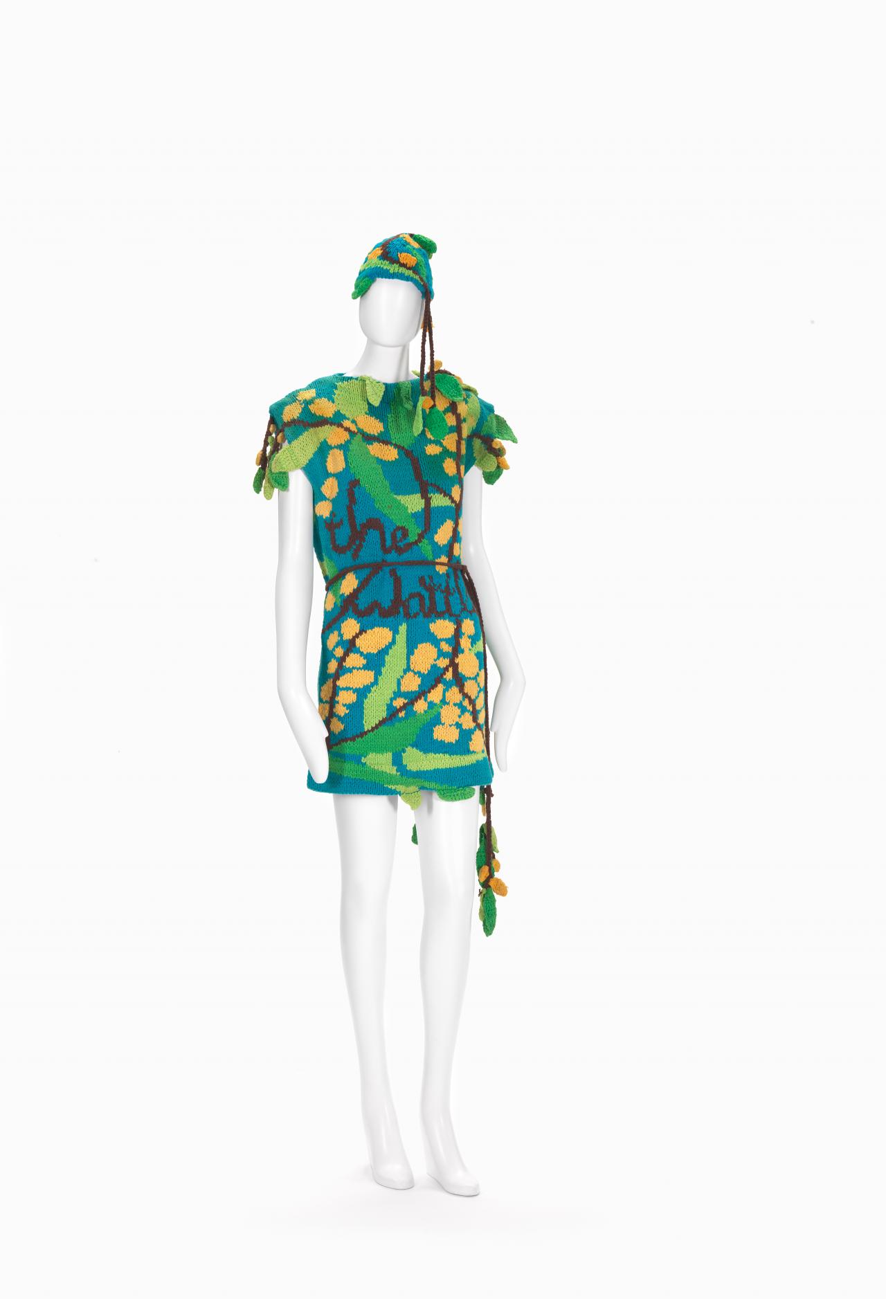 FLAMINGO PARK, Sydney (fashion house)<br />
 Jenny KEE (designer)<br/>
<em>Wattle dress and hat</em> 1978 <!-- (view 1) --><br />

knitted cotton<br />
(a) 75.0 cm (centre back) 45.0 cm (waist, flat) (dress) (b) 3.0 x 150.0 cm (belt) (c) 14.5 cm (height) 23.0 cm (depth) 54.0 cm (outer circumference) (hat)<br />
National Gallery of Victoria, Melbourne<br />
Purchased, Victorian Foundation for Living Australian Artists, 2016<br />
2016.11.a-c<br />
© Jenny Kee
<!--118278-->