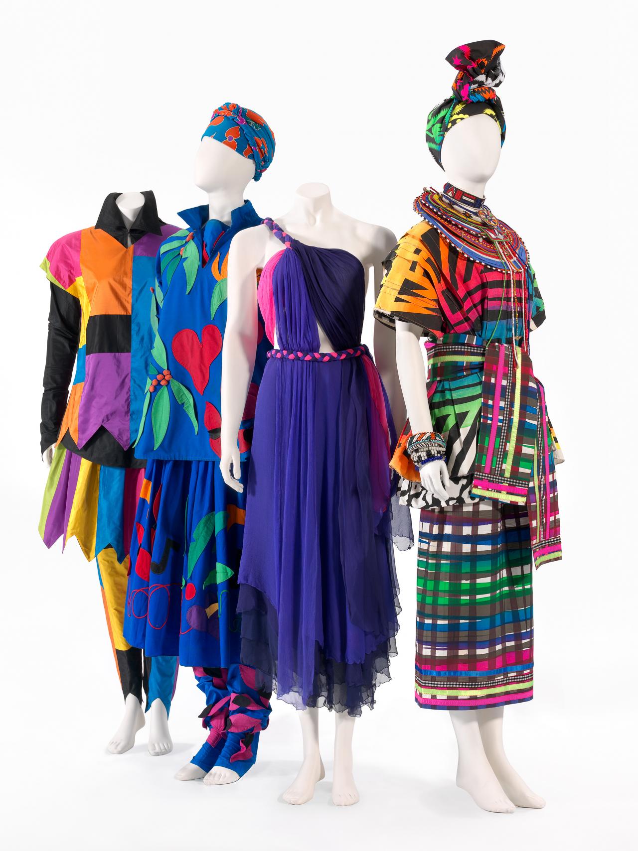 Left to right:<br/>
Flamingo Park, Sydney (fashion house)<br/>
Australia 1973–95<br/>
Linda Jackson (designer)<br/>
Australia 1950–<br/>
<em>Harlequin</em> 1977<br/>
silk (taffeta), rubber (elastic), cotton<br/>
a) 58.5 cm (centre back), 51.0 (width) (tunic top) <br/>
b) 71.0 cm (centre back), 55.0 cm (sleeve length) (reversible shirt) <br/>
c) 71.0 cm (centre back), 91.5 cm (sleeve length) (long sleeve top)<br/>
d) 66.5 cm (centre back), 28.0 cm (waist flat) (skirt)<br/>
e) 105.0 cm (outer leg), 52.0 cm (waist flat) (pants)<br/>
<br/>
<em>Wildflowers</em> 1976<br/>
cotton, silk<br/>
a) 70.0 cm (centre back); 62.5 cm (sleeve length) (long sleeved top) <br/>
b) 61.0 cm (centre front); 41.0 cm (width) (oval top)<br/>
c) 77.4 cm (centre back); 35.0 cm (waist flat) (skirt)<br/>
d) 64.0 cm (outer leg); 19.5 cm (width) (legging)<br/>
e) 64.0 cm (outer leg); 19.5 cm (width) (legging)<br/>
f) 116.0 x 113.0 (head scarf) <br/>
<br/>
<em>Titania</em> 1975<br/>
silk (chiffon)<br/>
90.0 cm (centre back); 33.0 cm (waist, flat)<br/>
<br/>
Bush Couture (fashion house)<br/>
Australia 1982–91<br/>
Linda Jackson (designer)<br/>
Australia 1950–<br/>
<em>Maasai Africa</em> 1982–88<br/>
cotton, lycra, plastic, metal<br/>
a) 70.0 cm (centre back); 91.5 cm (width across shoulder) (zebra print top)<br/>
b) 58.0 cm (centre back); 80.5 cm (width across shoulder) (Ndebele print pleat top)<br/>
c) 88.5 cm (centre back); 27.5 cm (waist flat) (skirt)<br/>
d) 18.0 x 186.0 cm (sash)<br/>
e) 34.5 x 194.0 cm (turban)<br/>
f-bb) various<br/>
<br/>
National Gallery of Victoria, Melbourne<br/>
Purchased, Victorian Foundation for Living Australian Artists, 2010 (2010.295.a-e), (2010.300.a-f), (2010.294.a-3), (2010.309.a-bb)<br/>