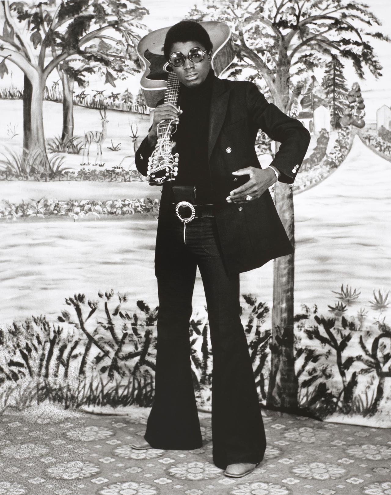 Studio portrait of man with guitar, Hamidou Maiga, 1973, Bamako, Mali, Victoria and Albert Museum<br/>
© Hamidou Maiga, courtesy of Jack Bell Gallery<br/>