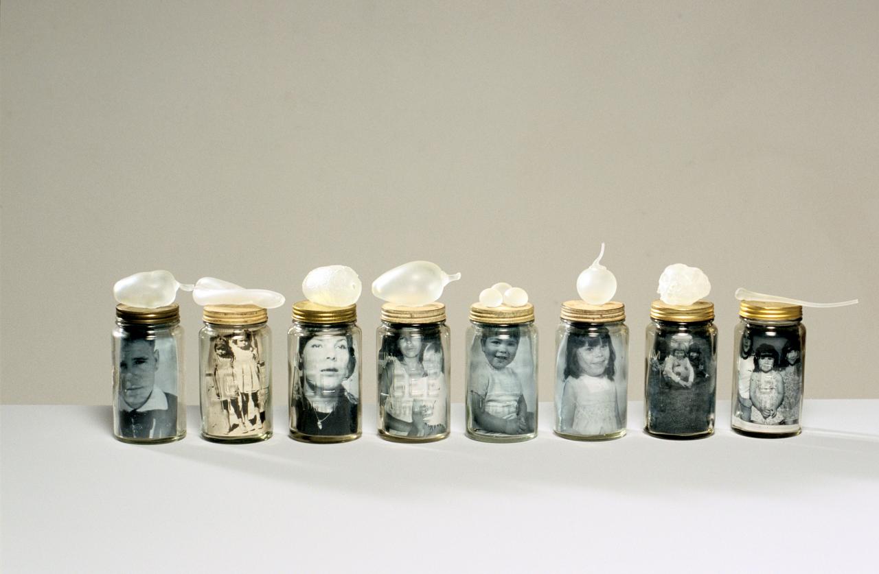 Yhonnie Scarce <br/>
Kokatha/Nukunu born 1973<br/>
<em>Oppression, Repression (Family Portrait)</em> 2004<br/>
blown glass, photographs and commercially manufactured jars<br/>
dimensions variable<br/>
National Gallery of Victoria, Melbourne<br/>
&copy; Yhonnie Scarce, courtesy Diane Tanzer Gallery + Projects