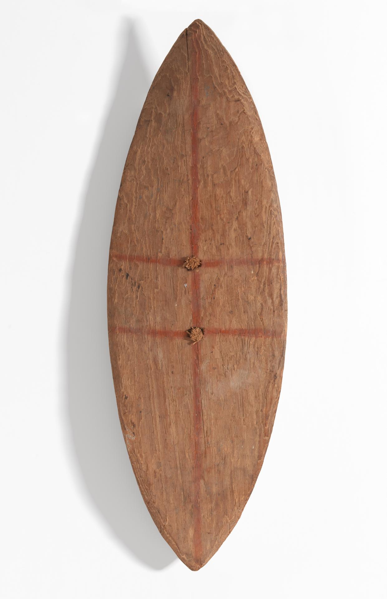 Unknown<br/>
<em>Shield</em> (c. 1800) <!-- (front view) --><br />

wood, cane, earth pigments<br />
88.0 x 28.9 x 6.9 cm<br />
National Gallery of Victoria, Melbourne<br />
Felton Bequest, 2011<br />
2011.137<br />

<!--89199-->