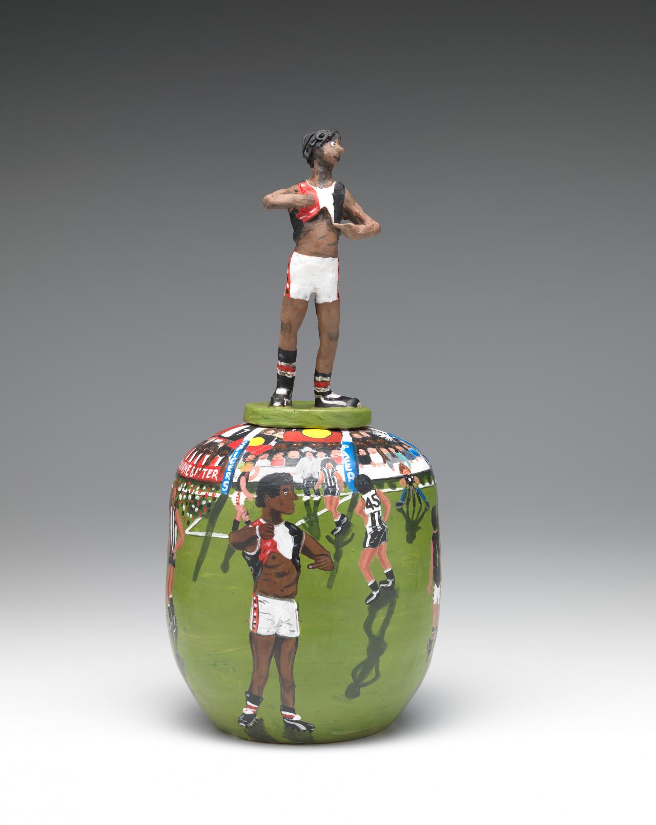 Rona Panangka Rubuntja<br/>
<em>I'm black (Nicky Winmar), covered vase</em> 2015 <!-- (full view) --><br />

earthenware<br />
(a-b) 53.1 x 24.8 cm diameter (overall)<br />
National Gallery of Victoria, Melbourne<br />
Purchased, Victorian Foundation for Living Australian Artists, 2015<br />
2015.448.a-b<br />
© Rona Panangka Rubuntja/Licensed by Copyright Agency, Australia
<!--117349-->