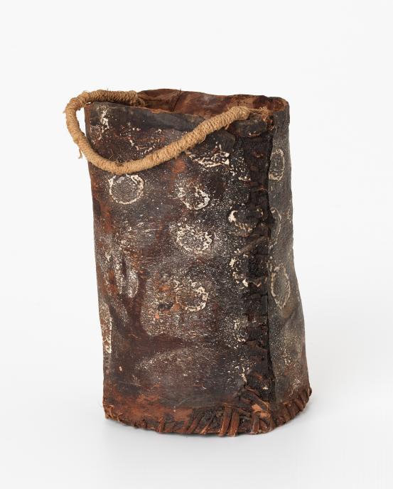Lily Karadada<br/>
<em>Garaggi (Bark bucket)</em> (c. 1970) <!-- (full view) --><br />

earth pigments on bark, bush string, resin<br />
48.5 x 22.1 x 21.1 cm<br />
National Gallery of Victoria, Melbourne<br />
Gift of Leo Pontonio, 2009<br />
2009.583<br />
© Lily Karadada/Licensed by Copyright Agency, Australia
<!--77974--><br/><a class="col-link block" href="/explore/collection/work/77974"><strong>Collection page <i class="fa fa-angle-right"></i></strong></a>