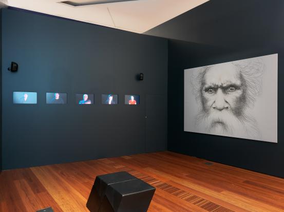 Vernon Ah Kee<br/>
<em>Ideas of Barak</em> 2011 <!-- (group) --><br />

charcoal on canvas, 5 channel colour video transferred to media player, 25 min 45 sec, sound<br />
(a-b) 251.5 x 806.0 cm (installation)<br />
National Gallery of Victoria, Melbourne<br />
Felton Bequest, 2011<br />
2011.121.a-b<br />
© Courtesy the artist and Milani Gallery, Brisbane
<!--99363--><br/><a class="col-link block" href="/explore/collection/work/99363"><strong>Collection page <i class="fa fa-angle-right"></i></strong></a>