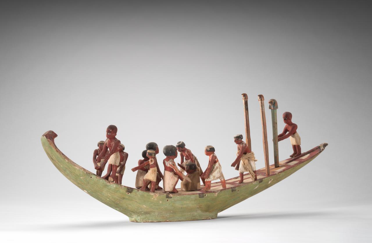 EGYPT<br/>
<em>Model of a boat with crew</em> Middle Kingdom, Dynasties mid XI–XII 2020 BCE-1773 BCE <!-- (full view) --><br />

wood, gesso, pigment<br />
80.3 x 31.8 x 14.3 cm<br />
National Gallery of Victoria, Melbourne<br />
Felton Bequest, 1939<br />
D90-1982<br />

<!--1323-->