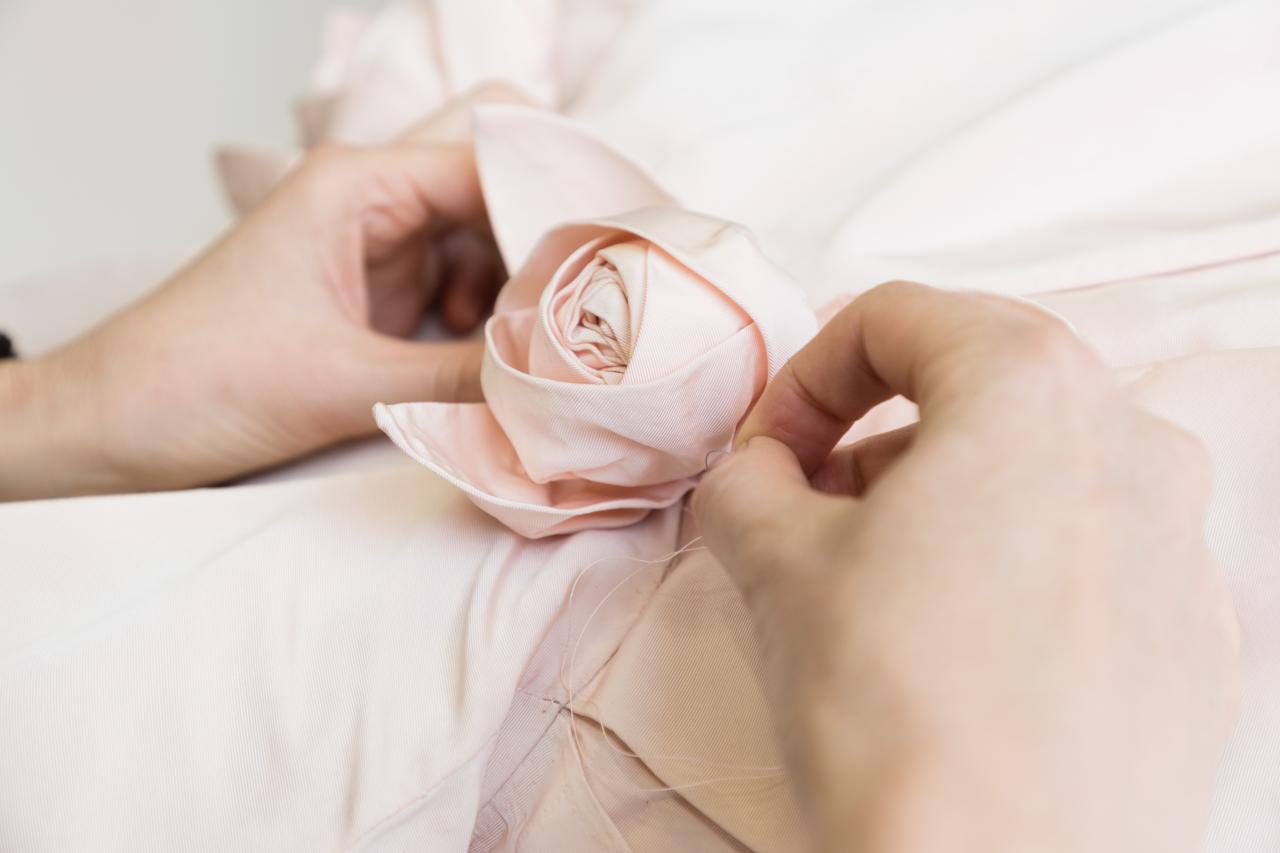 Kate Douglas, Conservator of Textiles, undertaking treatment.<br/>
CHRISTIAN DIOR, Paris (fashion house)<br/>
Yves SAINT LAURENT (designer)<br/>
<em>Porcelaine, evening dress</em> 1958<br/>
2017.119<br/>
122816<br/>