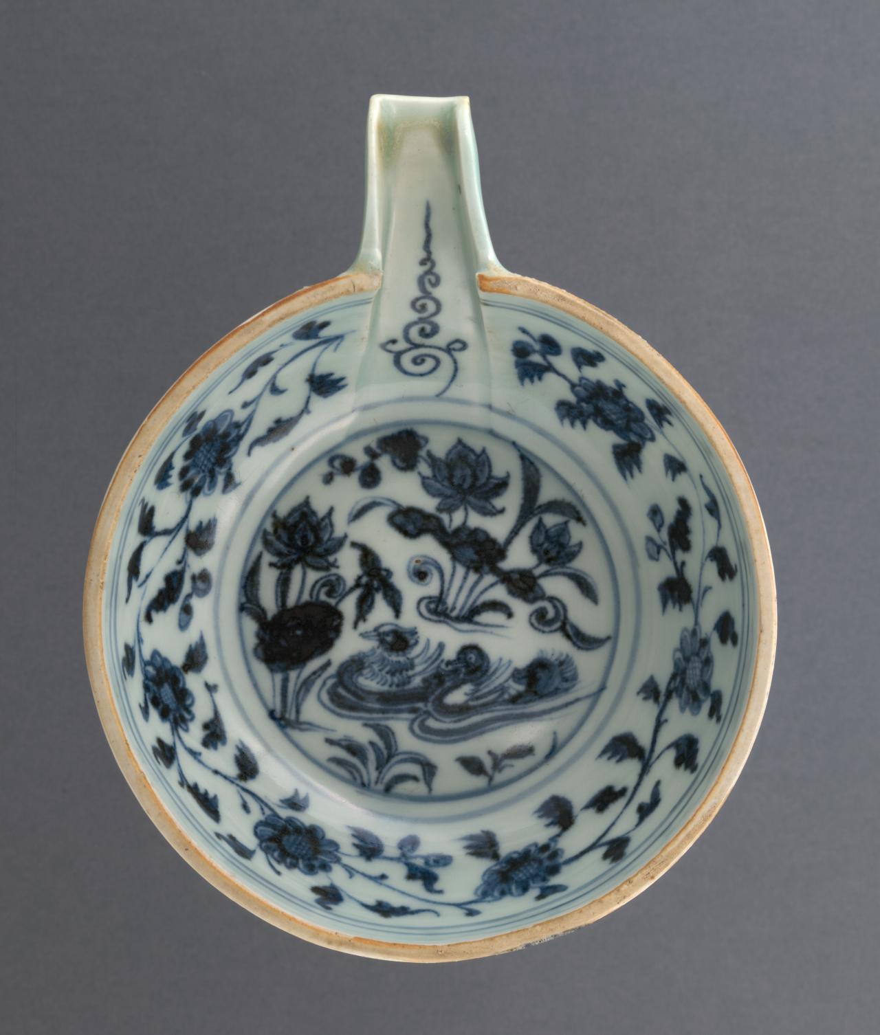 CHINESE<br/>
<em>Pouring bowl</em> (14th century) <!-- (full view) --><br />
<em>(Qing hua yuan yang he hua yi青花鴛鴦荷花匜)</em><br />
porcelain (blue and white ware)<br />
4.3 x 17.3 x 13.8 cm<br />
National Gallery of Victoria, Melbourne<br />
Felton Bequest, 1962<br />
429-D5<br />

<!--52536-->