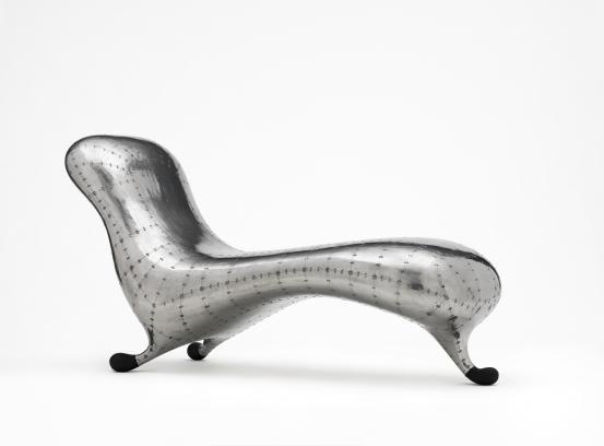 Marc NEWSON (designer)<br/>
<em>Lockheed lounge</em> (1985-1986) {designed} <!-- (view 1) --><br />

fibreglass, aluminium, rubber<br />
89.0 x 170.0 x 65.0 cm<br />
National Gallery of Victoria, Melbourne<br />
Purchased from Admission Funds, 1990<br />
D17-1990<br />
&copy; Marc Newson
<!--21118-->
