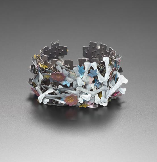 Helen BRITTON<br/>
<em>Flowers and bones, bangle</em> (2014) <!-- (view 1) --><br />

silver, enamel<br />
6.5 x 9.0 x 5.5 cm (variable)<br />
National Gallery of Victoria, Melbourne<br />
Purchased, Victorian Foundation for Living Australian Artists, 2019<br />
2019.248<br />
&copy; Helen Britton
<!--139111-->
