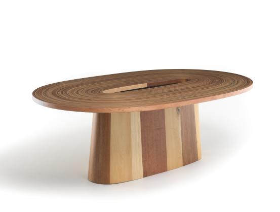 Brodie NEILL (designer)<br/>
<em>ReCoil, table</em> 2021 {designed}; 2023 {manufactured} <!-- (view 1) --><br />

Huon Pine (Largarostrobus franklinii), Tasmanian Oak (Eucalyptus sp.), Celery top pine (Phyllocladus aspleniifolius),
Sassafras, Myrtle and Blackwood (Acacia melanoxylon), resin, metal<br />
75.0 x 220.4 x 135.0 cm<br />
National Gallery of Victoria, Melbourne<br />
Purchased with funds donated by Chris Thomas AM and Cheryl Thomas, Noel Fermanis, Robyn and Ross Wilson, Beatrice Moignard and Emily Hardy and Woods5 Foundation, 2023<br />
2023.593<br />
&copy; Brodie Neill
<!--151181-->