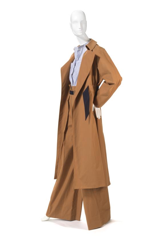 MARTIN GRANT, Paris (fashion house)<br />
 Martin GRANT (designer)<br/>
<em>Look 1, trench coat, shirt, pants, belt</em> 2017 {spring-summer 2017} <!-- (side view) --><br />

cotton (poplin, sateen), leather (lambskin), metal, plastic (fastenings)<br />
(a) 130.0 cm (centre back) 76.5 cm (sleeve length) (trench coat) (b) 71.0 cm (centre back) 66.0 cm (sleeve length) (shirt) (c) 123.5 cm (outer leg) 32.5 cm (waist, flat) (trousers) (d) 3.0 x 82.0 cm (belt)<br />
National Gallery of Victoria, Melbourne<br />
Gift of the artist, 2023<br />
2023.526.a-d<br />

<!--147768-->