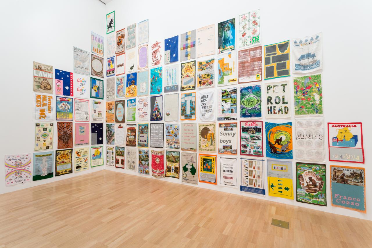 Jon CAMPBELL<br/>
<em>DUNNO (T. Towels)</em> (2012) <!-- (installation) --><br />

synthetic polymer paint, metallic paint, enamel paint, fibre-tipped pen and glitter on printed cotton and linen, collage of cut tea towels, printed paper, synthetic polymer paint and fibre-tipped pen on paper, oil and synthetic polymer paint on canvas<br />
(a-gggg) 320.0 x 1160.0 cm (variable) (overall)<br />
National Gallery of Victoria, Melbourne<br />
Yvonne Pettengell Bequest, 2014<br />
2014.60.a-gggg<br />
© Courtesy of the artist
<!--109267-->