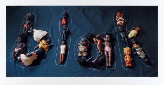 Destiny Deacon<br/>
<em>BLAK</em> 2020 <!-- (recto) --><br />

lightjet photograph<br />
(100.0 x 213.0 cm) (image) (122.6 x 236.2 cm) (sheet)<br />
ed. 1/5<br />
National Gallery of Victoria, Melbourne<br />
Purchased, Victorian Foundation for Living Australian Artists, 2021<br />
2021.177<br />
© Estate of Destiny Deacon/ Licensed by Copyright Agency, Australia
<!--146117--><br/><a class="col-link block" href="/explore/collection/work/146117"><strong>Collection page <i class="fa fa-angle-right"></i></strong></a>