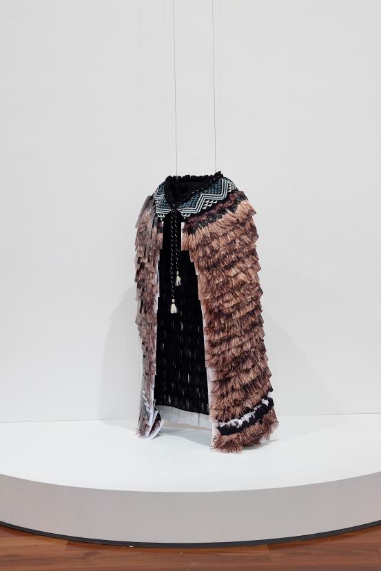Kirsten LYTTLE<br/>
<em>Kahu Whakaahua cloak</em> (2022-2023) <!-- (full view) --><br />

inkjet prints, cotton, linen, emu feathers<br />
148.0 x 90.6 x 44.5 cm (overall)<br />
National Gallery of Victoria, Melbourne<br />
Commissioned by the National Gallery of Victoria, Melbourne. Purchased, Victorian Foundation for Living Australian Artists, 2023<br />
2023.189<br />
© Kirsten Lyttle
<!--149731--><br/><a class="col-link block" href="/explore/collection/work/149731"><strong>Collection page <i class="fa fa-angle-right"></i></strong></a>