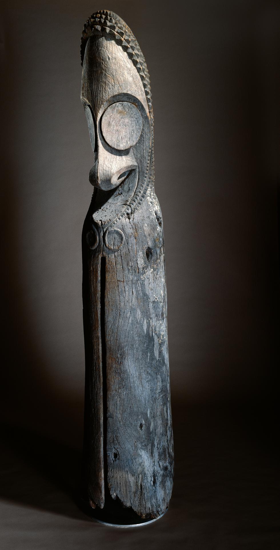 Ambrym Island, Vanuatu<br/>
<em>Tam Tam slit-drum</em> c.1960<br/>
wood<br/>
277.0 x 50.5 x 50.5 cm<br/>
Presented through The Art Foundation of Victoria<br/>
by Michael J. Ball, Fellow, 1998 (1998.338)<br/>