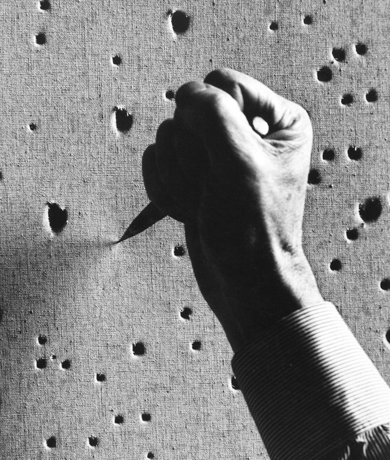 Ugo Mulas<br/>
Italian 1928–1973<br/>
<em>Lucio Fontana: Milan</em> c.1963 (detail)<br/>
silver bromide print<br/>
38.0 x 27.2 cm<br/>
© 2005 Ugo Mulas Estate<br/>
Photo courtesy Sue Bond Public Relations.<br/>
Exhibited in <em>Viewpoints: Italy in Black and White</em><br/>
at the Estorick Collection of Modern Italian Art,<br/>
London<br/>