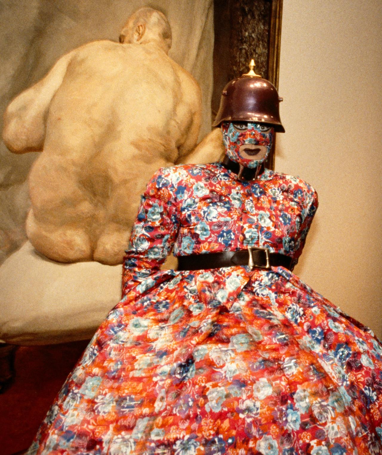 fig. 1<br/>
Leigh Bowery (designer)<br/>
born Australia 1961, worked in Great Britain 1981–94, died Great Britain 1994<br/>
<em>The Metropolitan</em> c.1988 (detail)<br/>
cotton, rayon, plastic, metal, paint<br/>
National Gallery of Victoria<br/>
Purchased, 1999 (1999.280.a-j)<br/>
Bowery at the opening of the Lucian Freud exhibition,<br/>
Metropolitan Museum of Art, New York, 1993<br/>
© Photograph: Don Pollard<br/>