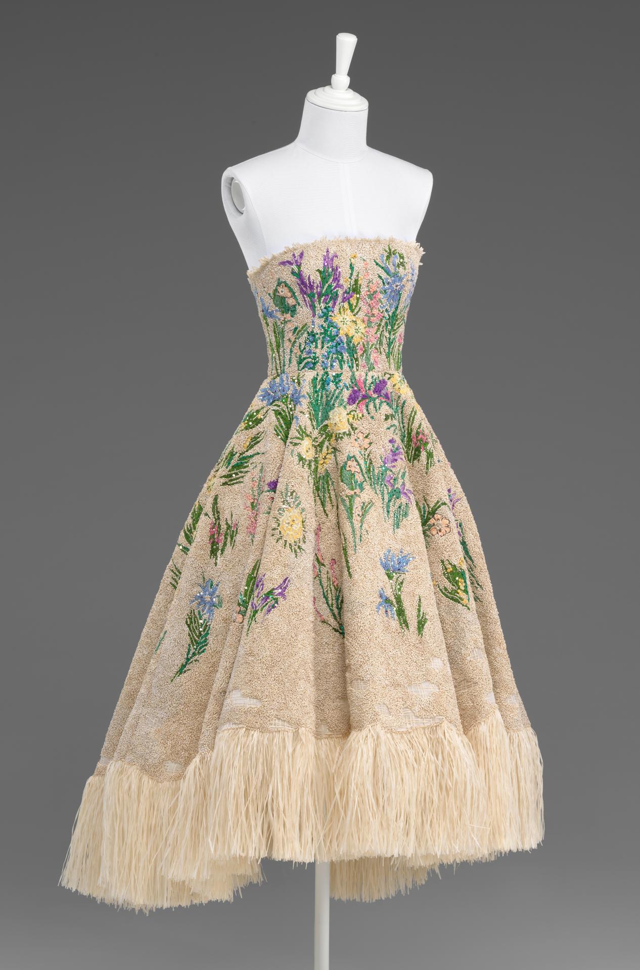 Christian Dior, Paris (couture house)<br/>
Maria Grazia Chiuri (designer)<br/>
<em>Spirit of Herbarium (Essence d’Herbier)</em> 2017 spring−summer <br/>
silk (organza), nylon (tulle), embroidery, raffia. metal (spangles)<br/>
(a) 105.0cm (centre back) 30.0 cm (waist, flat) (dress) <br/>
(b) 68.5 cm (centre back) 30.0 cm (waist, flat) (underskirt)<br/>
National Gallery of Victoria, Melbourne<br/>
David Richards Bequest and NGV Supporters of Fashion and Textiles, 2018<br/>
(2017.457.a-b)<br/>
© Christian Dior Couture