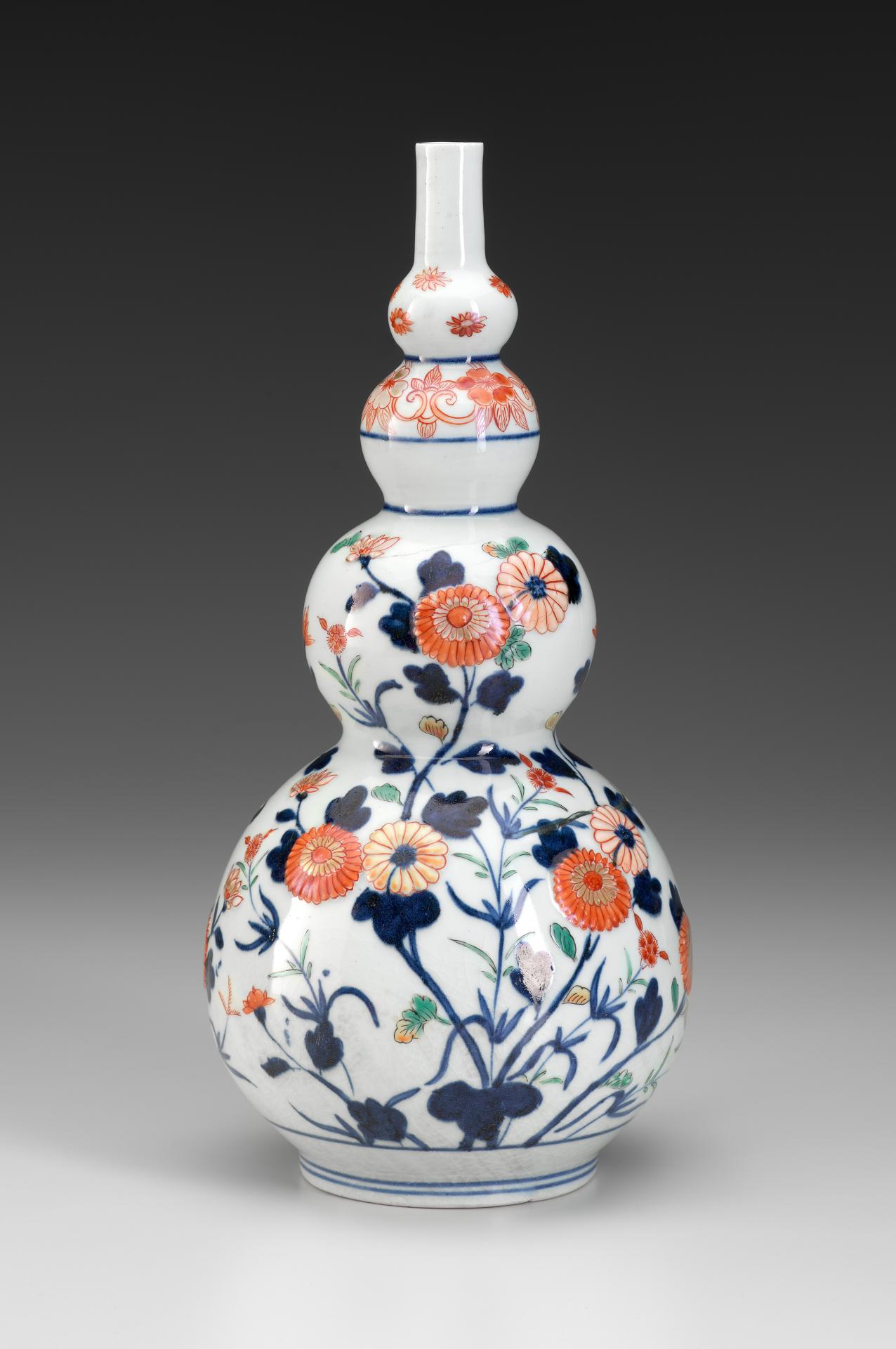 JAPANESE <br/>
<em>Gourd shaped bottle with chrysanthemums</em><br/>
mid eighteenth century, Arita, Kyushu, Japan<br/>
porcelain, gilt, enamel (Ko-Imari ware)<br/>
34.5 x 16.6 cm diameter<br/>
National Gallery of Victoria<br/>
Purchased with funds donated by Pauline Gandel, 2018<br/>