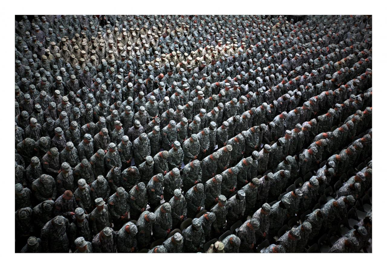 Ashley Gilbertson<br/>
<em>1,215 American soldiers, airmen, Marines and sailors pray before a pledge of enlistment on July 4, 2008, at a massive re-enlistment ceremony at one of Saddam Hussein's former palaces in Baghdad, Iraq</em>. From the series <em>Whiskey Tango Foxtrot</em> 2008<br/>
type C photograph<br/>
69.0 x 94.0 x 5.5 cm<br/>
Courtesy of the artist<br/>
© Ashley Gilbertson / VII