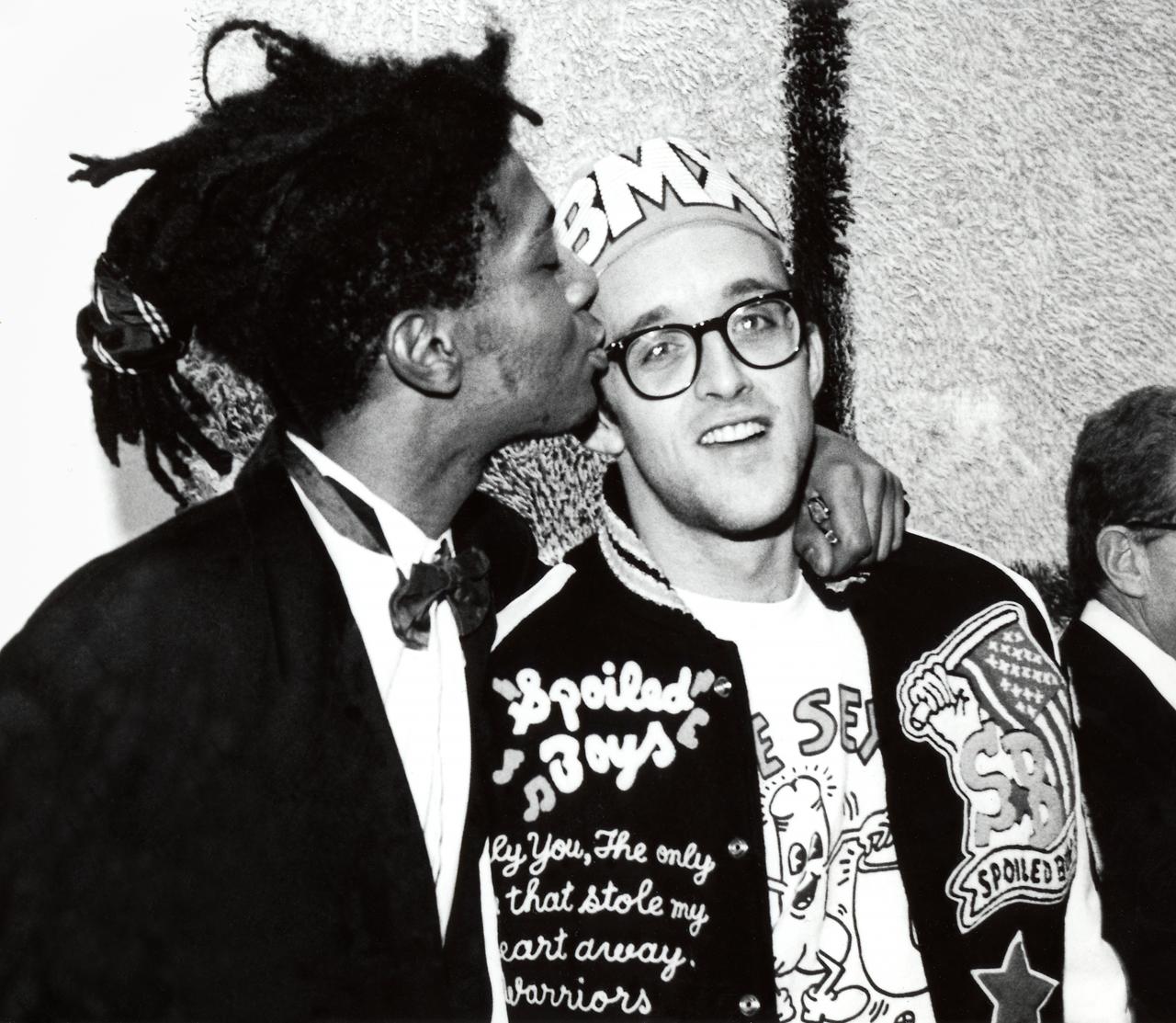 Keith Haring and Jean-Michel Basquiat at the opening reception for Julian Schnabel at the Whitney Museum of American Art, New York, 1987<br/>
Photo: © George Hirose