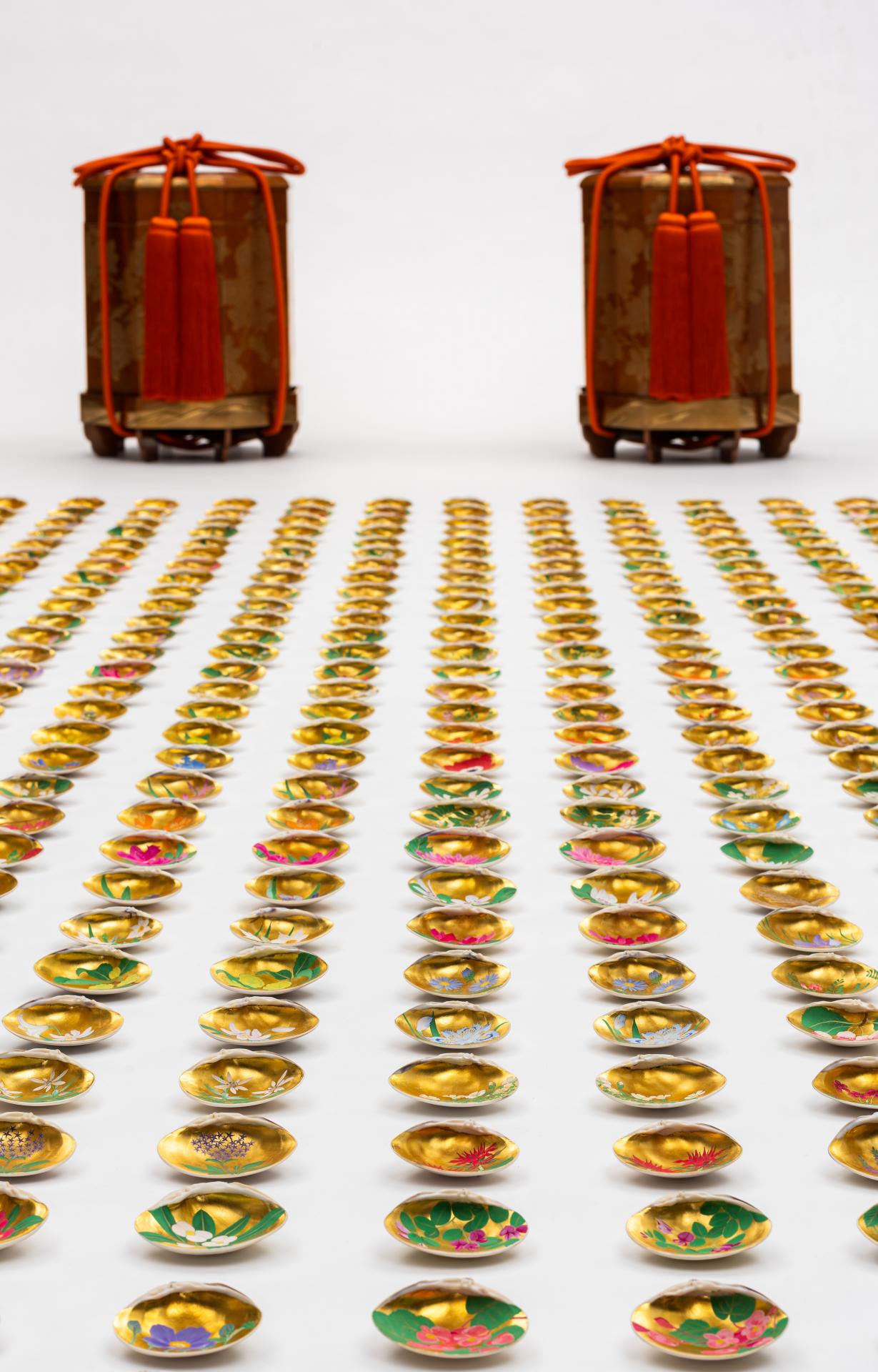 UNRYUAN, KITAMURA Tatsuo<br/>
Japanese 1952–<br/>
<em>Chrysanthemum kai-oke shell boxes and kai-awase shells</em> (installation)<br/>
<em>(Kiku maki-e kai-oke to kai-awase)</em><br/>
2015<br/>
lacquer on wood (<em>maki-e, chinkin</em>), gold, silver, silk, shell, gilt,<br/>
colour pigment<br/>
Collection of Dr Pauline Gandel, Melbourne<br/>