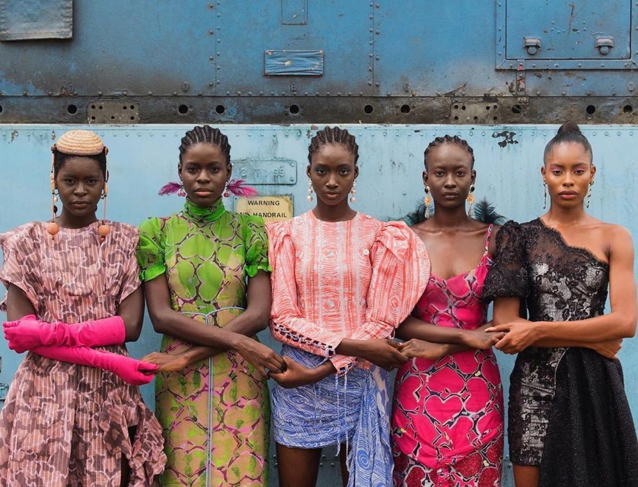 Stephen Tayo<br/>
<em>Models holding hands, Lagos, Nigeria</em> 2019<br/>
Courtesy Victoria and Albert Museum, London and Lagos Fashion Week<br/>
Photo © Stephen Tayo