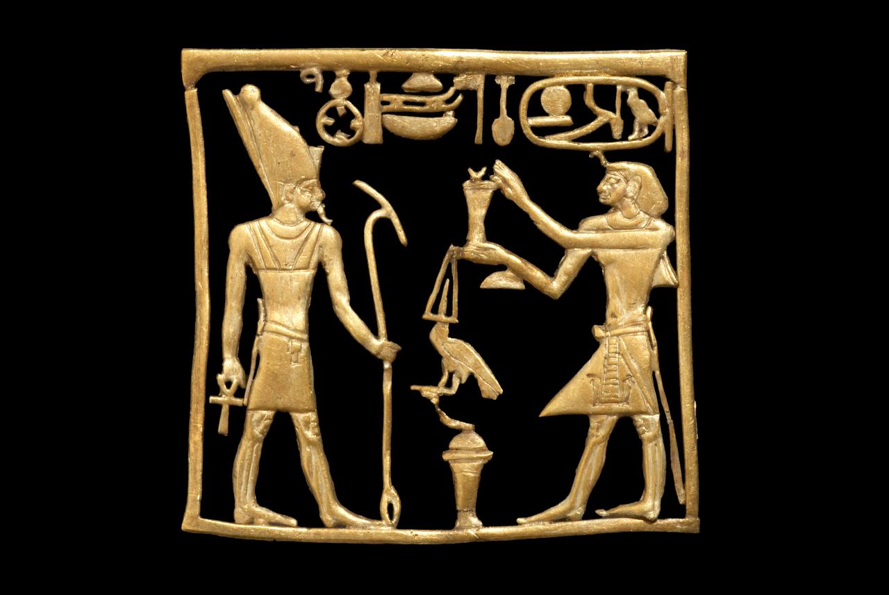 Plaque showing King Amenemhat IV offering ointment to the god Atum, Lord of Heliopolis  <br/>
Lebanon, Byblos  <br/>
12th Dynasty, reign of Amenemhat IV, about 1808–1799 BCE  <br/>
gold<br/>
H 2.9 cm, W 3.1 cm, D 0.1 cm ​ <br/>
British Museum, London <br/>
EA59194<br/>
​© The Trustees of the British Museum