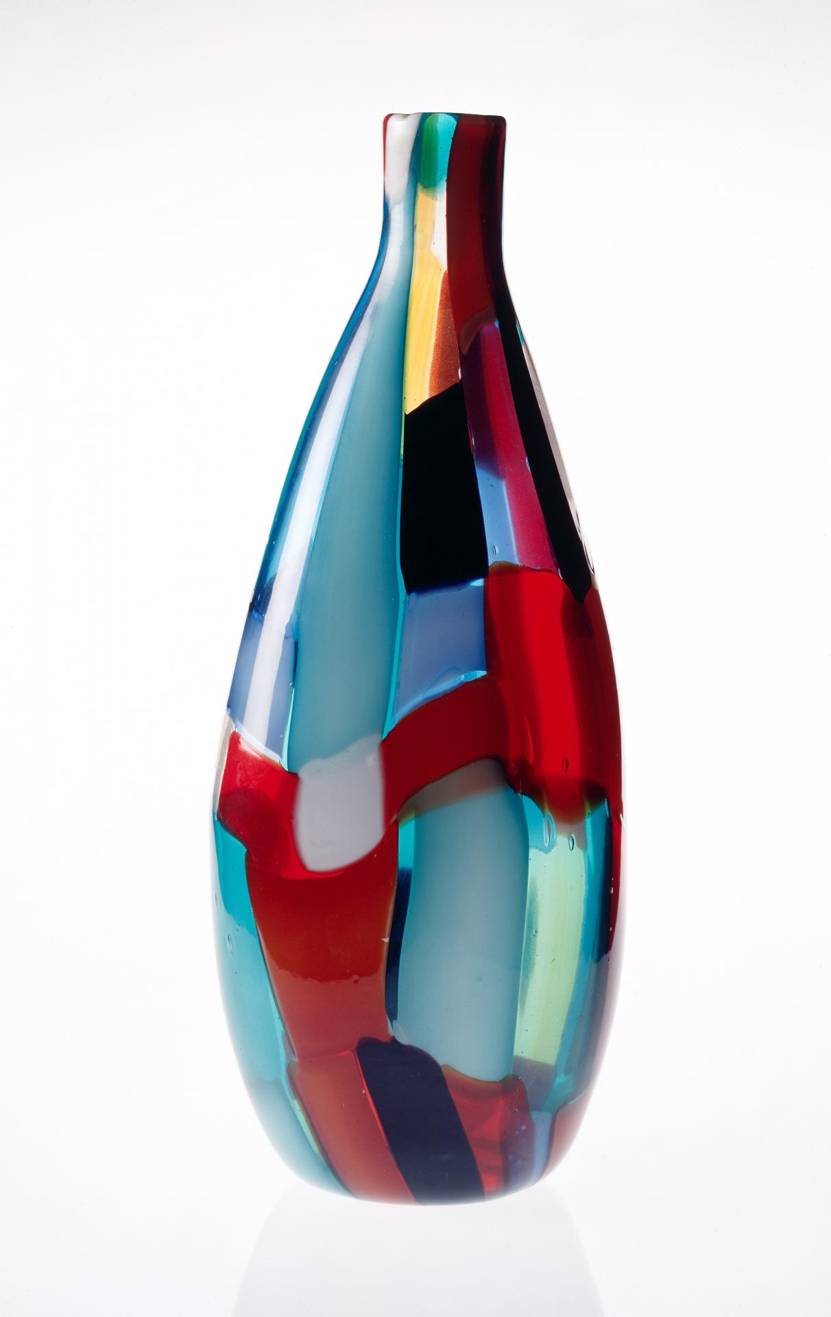 VENINI & CO., Murano (manufacturer)<br />
 Fulvio BIANCONI (designer)<br/>
<em>Patchwork (Pezzato) vase</em> (c. 1950) <!-- (full view) --><br />

glass<br />
36.6 x 14.6 x 10.9 cm<br />
National Gallery of Victoria, Melbourne<br />
Felton Bequest, 1952<br />
1244-D4<br />

<!--21236-->