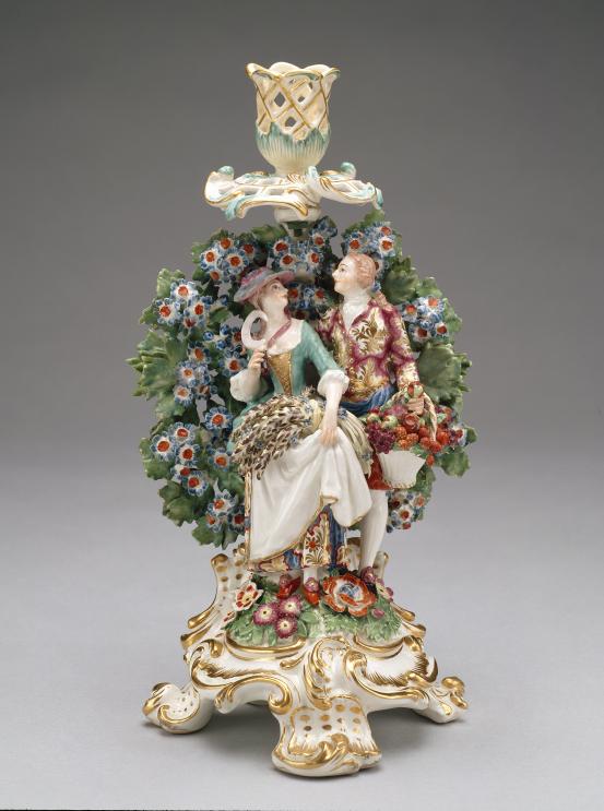 CHELSEA PORCELAIN FACTORY, London (manufacturer)<br/>
<em>Summer and autumn, from The four seasons, candlestick</em> (c. 1765) <!-- (front view) --><br />

porcelain (soft-paste)<br />
30.5 x 16.5 x 14.4 cm<br />
National Gallery of Victoria, Melbourne<br />
The Colin Templeton Collection. Gift of Mrs Colin Templeton, 1942<br />
426.2-D4<br />

<!--73951-->