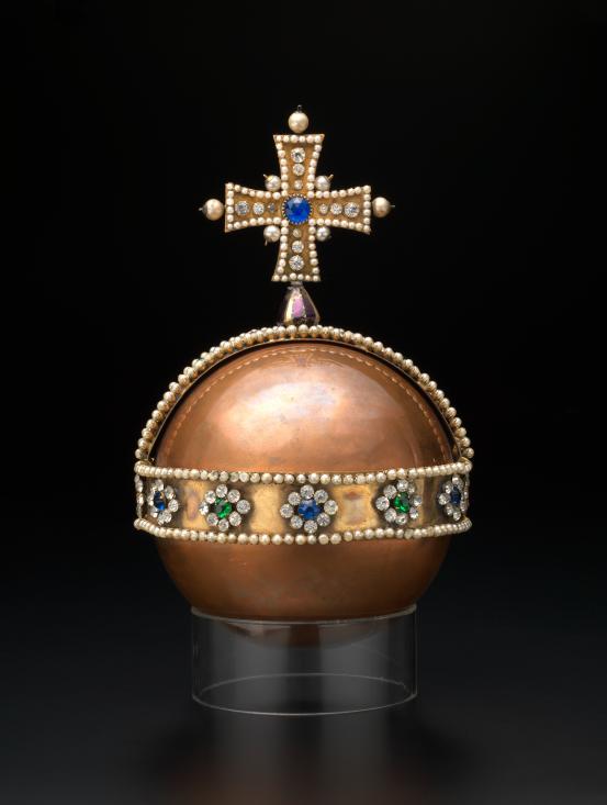 ENGLAND (manufacturer)<br/>
<em>Sovereign&rsquo;s Orb</em> (c. 1936) <!-- (front view) --><br />

brass, copper, steel, velvet, synthetic fur, paste, metallic cord, (stuffing)<br />
25.0 x 17.0 x 17.0 cm<br />
National Gallery of Victoria, Melbourne<br />
Gift of Mr Alex Isaacson, 1938<br />
3787B.r-D3<br />

<!--104277--><br/><a class="col-link block" href="/explore/collection/work/104277; 104291"><strong>Collection page <i class="fa fa-angle-right"></i></strong></a>