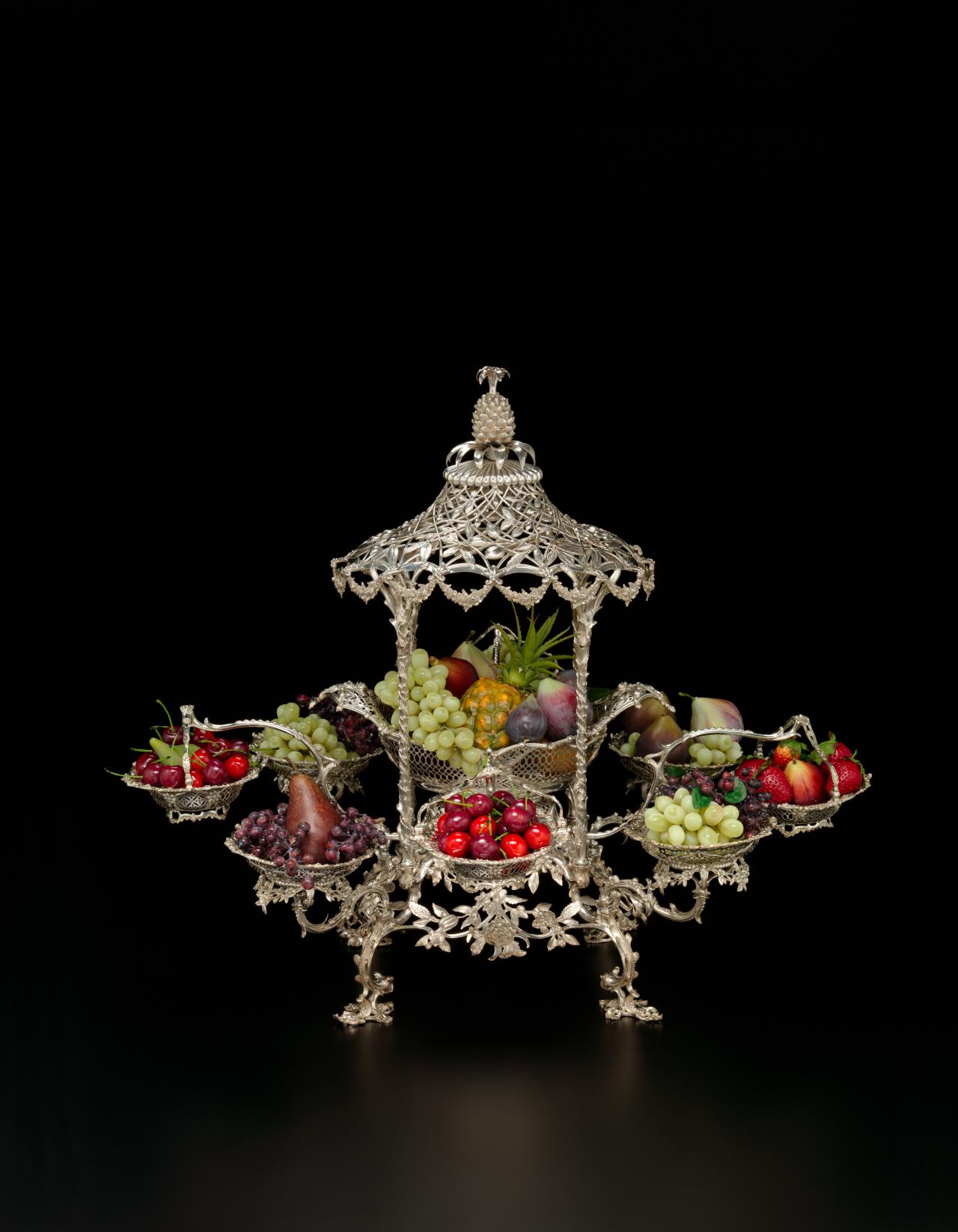 THOMAS PITTS, London (manufacturer)<br/>
<em>Epergne</em> (1762-1763) <!-- (front) --><br />

silver<br />
(a-w) 63.6 x 76.3 x 64.8 cm (overall)<br />
National Gallery of Victoria, Melbourne<br />
Felton Bequest, 1932<br />
3304.a-w-D3<br />

<!--15185-->