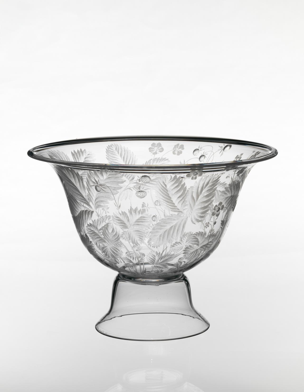 KOSTA GLASSWORKS, Kosta (manufacturer)<br />
 Sigurd PERSSON (maker)<br />
 Lisa BAUER (engraver)<br/>
<em>Wild strawberry, bowl</em> 1974 <!-- (full view) --><br />

glass (engraved)<br />
25.6 x 34.6 x 35.5 cm<br />
National Gallery of Victoria, Melbourne<br />
Presented by Kosta Boda, 1976<br />
D110-1976<br />
© Sigurd Persson/BUS, Stockholm. Licensed by Copyright Agency, Australia
<!--14197-->