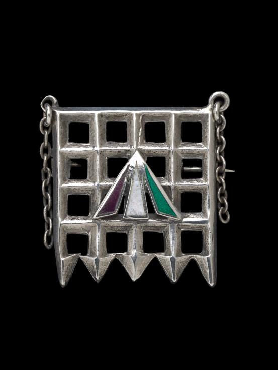 Sylvia PANKHURST (designer)<br />
 TOYE & CO., London (manufacturer)<br/>
<em>Holloway brooch</em> 1909 {designed} <!-- (view 4) --><br />

silver, enamel<br />
2.5 x 1.9 x 0.2 cm<br />
National Gallery of Victoria, Melbourne<br />
Gift of Krystyna Campbell-Pretty and the Campbell-Pretty Family through the Australian Government&rsquo;s Cultural Gifts Program, 2019<br />
2019.40<br />
&copy; Sylvia Pankhurst
<!--138680-->

