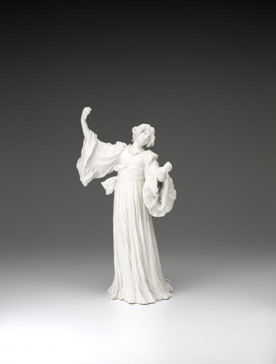 S&Egrave;VRES PORCELAIN FACTORY, S&egrave;vres (manufacturer)<br />
 Agathon L&Eacute;ONARD (modeller)<br/>
<em>Singing dancer, from The Scarf Dance table centrepiece, model no. 2</em> 1898 {modelled}; (1901) {manufactured} <!-- (front) --><br />
<em>(Danseuse chantant, from the table centrepiece Le Jeu de L&rsquo;&Eacute;charpe)</em><br />
porcelain (biscuit, hard paste)<br />
46.4 x 26.2 x 22.2 cm<br />
National Gallery of Victoria, Melbourne<br />
Gift of Krystyna Campbell-Pretty AM and Family through the Australian Government's Cultural Gifts Program, 2021<br />
2021.534<br />

<!--146188-->