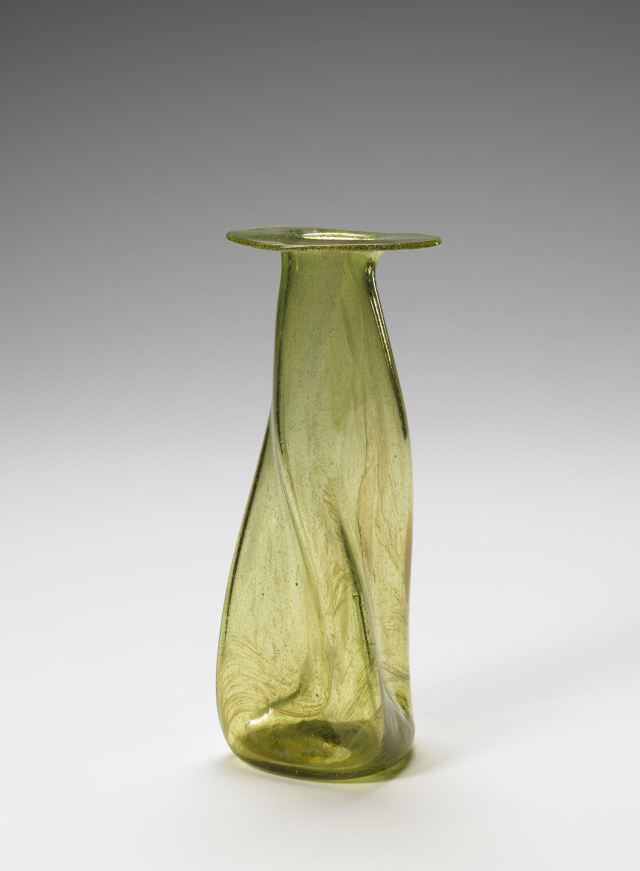 Christopher DRESSER (designer)<br />
 JAMES COUPER & SONS, Glasgow (manufacturer)<br/>
<em>Clutha, propeller vase</em> (c. 1895) <!-- (full view) --><br />

glass<br />
28.3 x 11.3 cm diameter<br />
National Gallery of Victoria, Melbourne<br />
Purchased with funds donated by Merv Keehn and Sue Harlow, 2025<br />
2025.532<br />

<!--157152-->