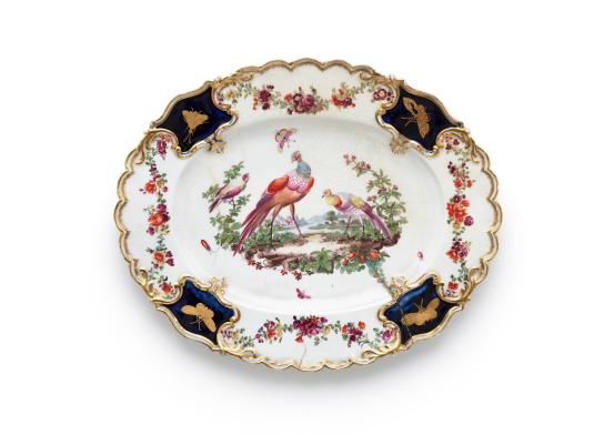CHELSEA PORCELAIN FACTORY, London (manufacturer)<br/>
<em>Dish</em> (c. 1763) <!-- (view) --><br />

porcelain (soft-paste)<br />
2.7 x 27.6 x 22.2 cm<br />
National Gallery of Victoria, Melbourne<br />
The Colin Templeton Collection. Gift of Mrs Colin Templeton, 1942<br />
379-D4<br />

<!--18087-->